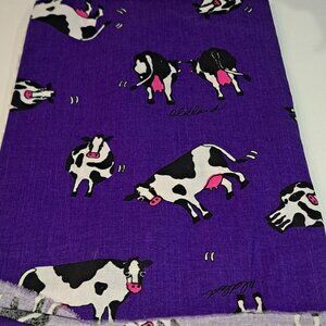 purple fabric with milk cows all over